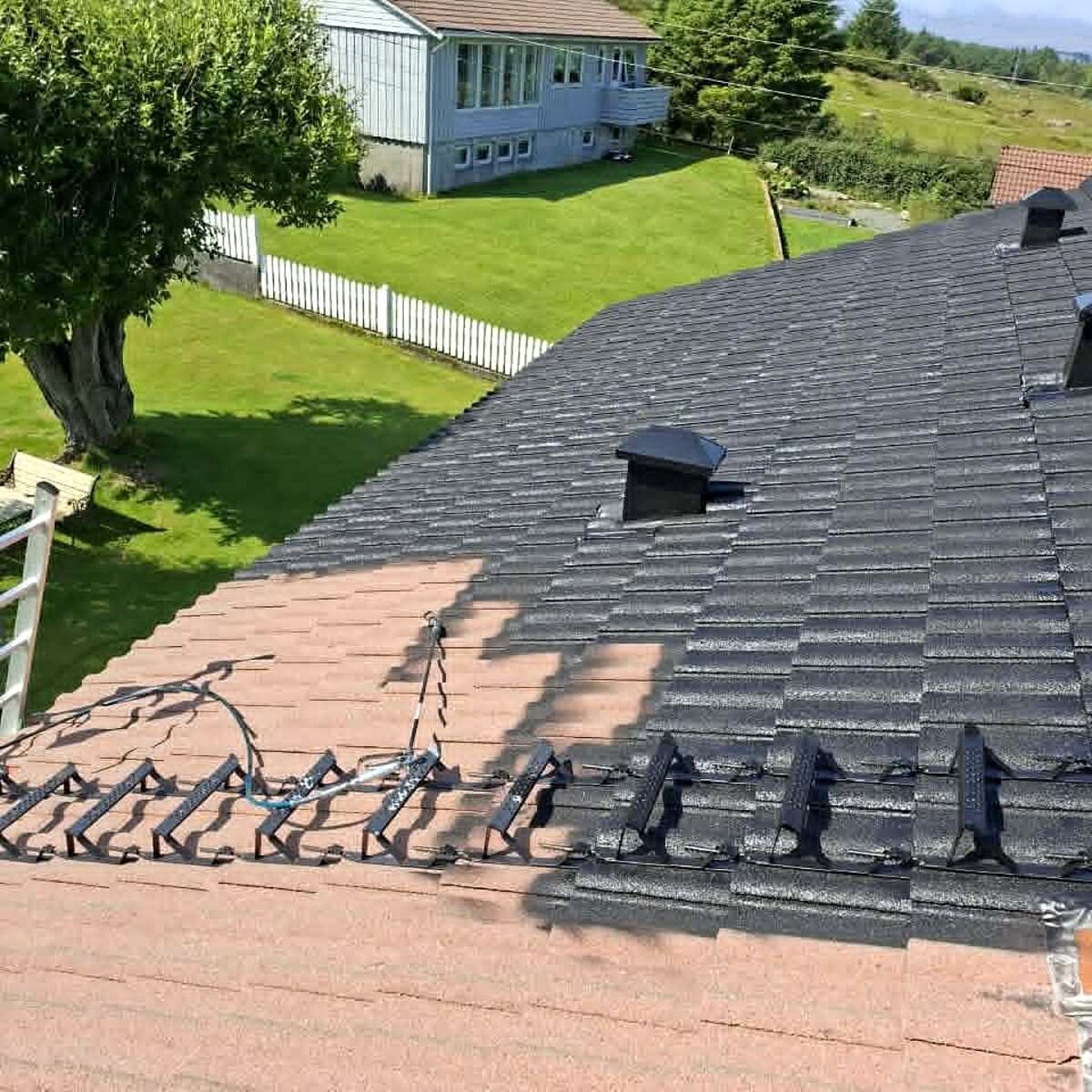 Roof coating in progress with a clear before-and-after contrast